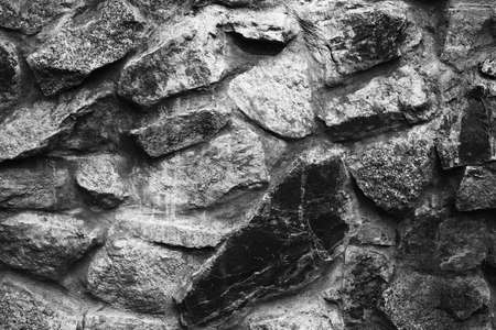 large stones, stone wall, ancient castle wall, dark textured wallsの写真素材