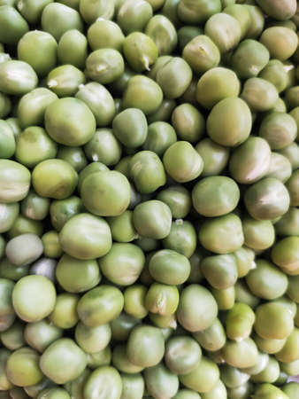 fresh raw green peas in bulk, vegetarian protein foodの写真素材