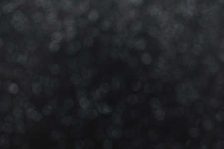 paper dark gray or black background with shiny splashesの写真素材