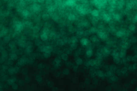 paper dark green background with shiny splashesの写真素材
