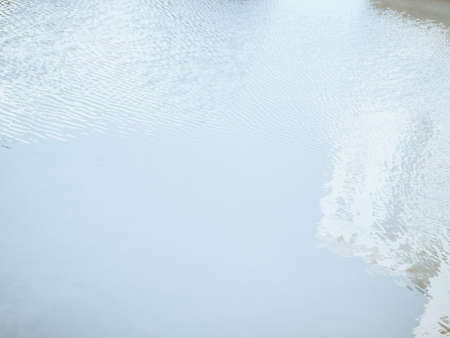 blurry reflection of houses in the waterの写真素材