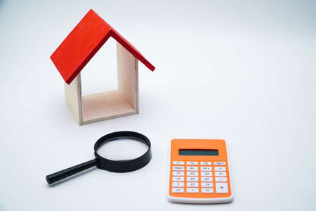 calculator, money and house with white background. copy space textの写真素材