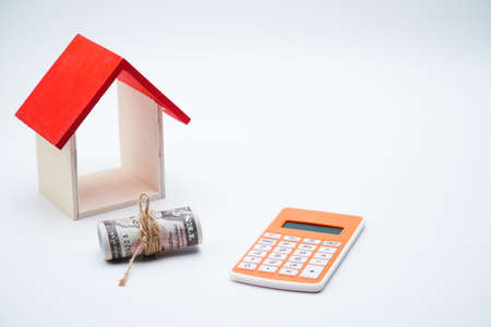 calculator, money and house with white background. copy space text