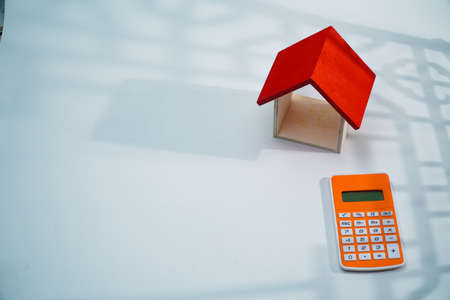 concept, calculator, money and house with white background. copy space textの写真素材