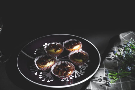 selective focus of cheese tart on the table with a cinematic light.
