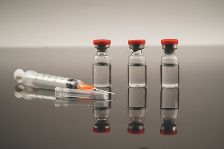 Close up Vaccines and syringe on the tableの写真素材