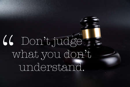 Top view text "dont't judge what you don't understand". concept judgeの写真素材