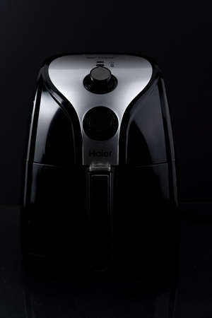 Shah Alam, Malaysia, 15 April 2021; Haier Air Fryer brand with a dark background, liked by locals.のeditorial素材