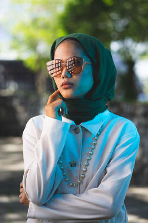 veiled women wearing sunglasses. cinematic portrait lightingの写真素材