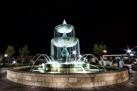 Long exposure of fountain at night in the parkの写真素材