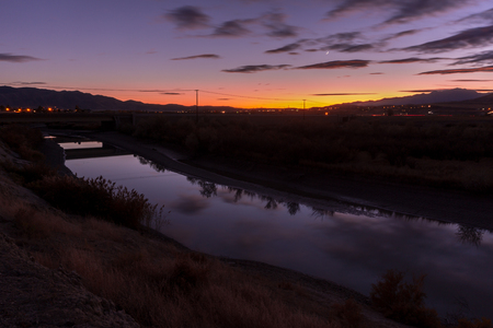 Landscape at dusk with a beautiful reflection off the river in a long exposure.の写真素材
