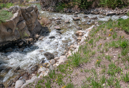 Small creek flows and splashes along a mountain stream in Utah, USAの写真素材