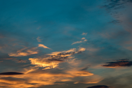 Beautiful and colorful background of a sunset sky during the golden hourの写真素材