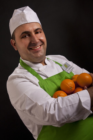 Fruit seller with several orangesの写真素材