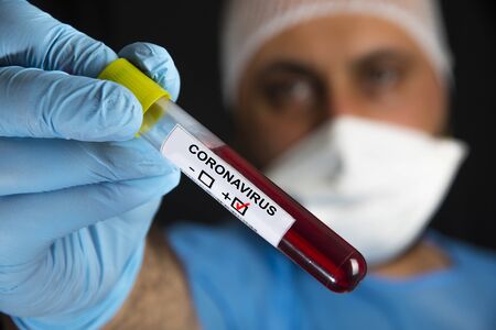 Blood sample tube positive with label COVID-19 or novel coronavirusの写真素材