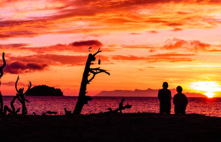 romantic couple at the sunset beachの写真素材
