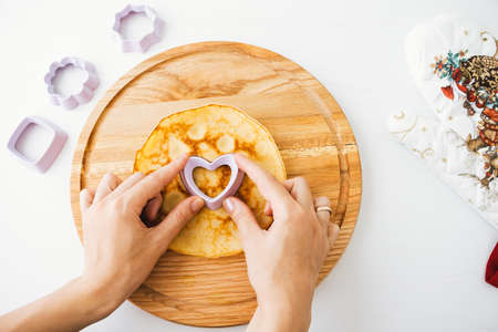 Woman hands cooking delicious american pancake. Breakfast ideas.の写真素材