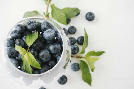Closeup of fresh blueberry in the glass jar.の写真素材
