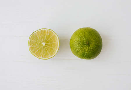 Closeup of fresh half lime on white background.の写真素材