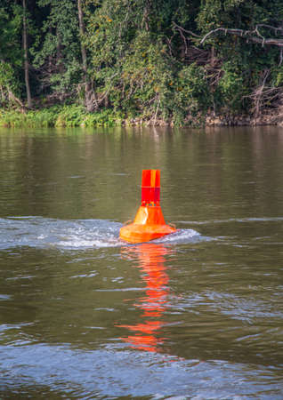 A boye on the German river Elbe during summerの写真素材