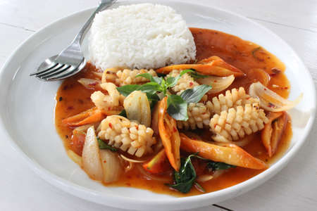 Stir fried red curry paste squid.の写真素材