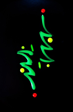 Photo of the multicolored liquid lacquer over black backgroundの写真素材