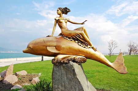 Bronze sculpture the Girl on a dolphin, the city of Novorossisk, Russiaの写真素材