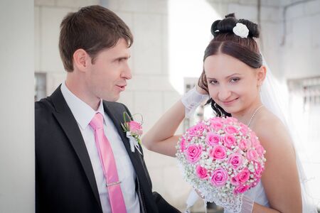 newly-married couple among columns of an ancient buildingの写真素材