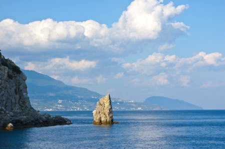 Ukraine, the Crimea - on September 7, 2012 - the Rock "Sail" and the tourists being on it in bathing suitsのeditorial素材