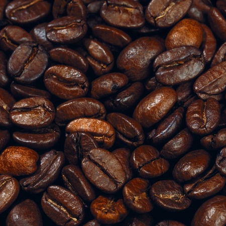Roasted coffee beams background. Close up view