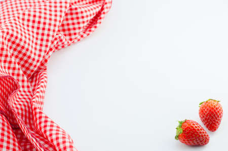 Red napkin and strawberry with place for your textの写真素材