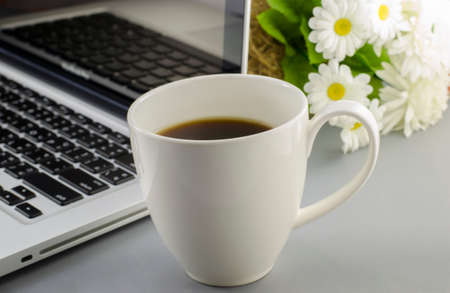 Morning coffee on computer deskの写真素材