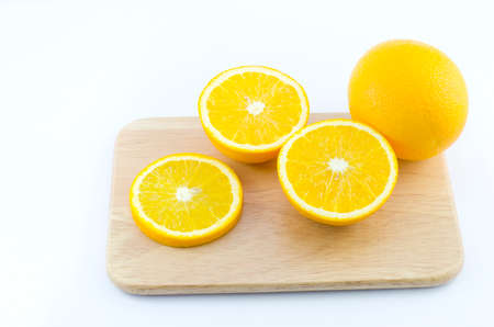 slice of orange and wooden boardの写真素材