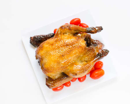 Roasted chicken and cherry tomatoesの写真素材