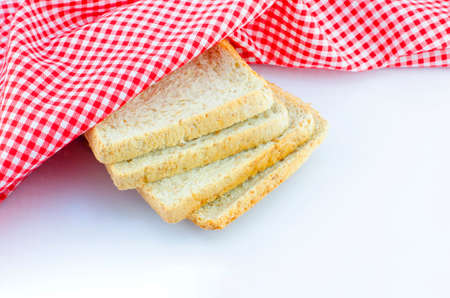 napkin and slice of breads on white backgroundの写真素材