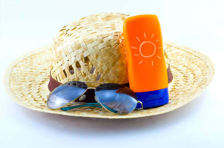 Hat with sunglasses and body lotion isolated on white backgroundの写真素材