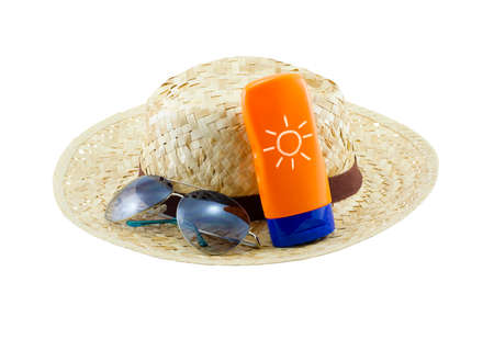 Hat with sunglasses and body lotion isolated on white backgroundの写真素材