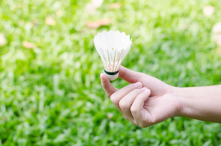 hand holding shuttlecockの写真素材