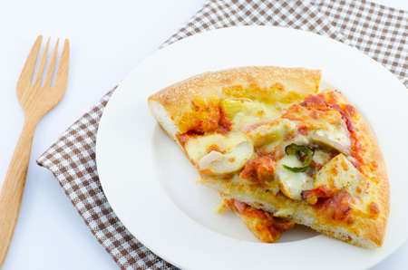 pizza in plate with napkin and forkの写真素材