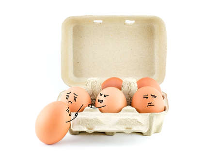 Funny Drawing Faces on Eggs in carton isolate on white with clipping pathの写真素材