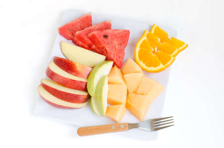 Fresh fruits in plate Apple MelonWatermelonOrange and guava with clipping pathの写真素材
