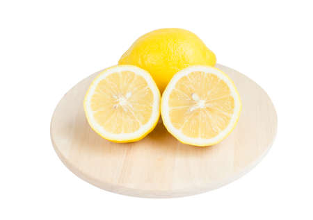 Lemon and slice on wooden board isolate on white with clipping pathの写真素材