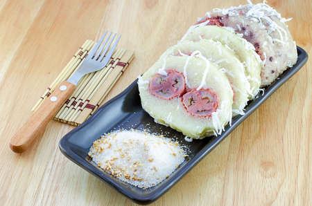 Thailand dessert Rice with banana and coconut boiled Sugar and sesame  Kao tom madの写真素材