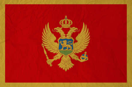 Flag of Montenegro with vintage old paperの写真素材