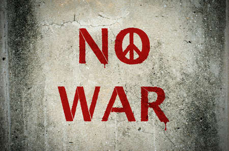 Red No War message and peace symbol graffiti on grunge ciment wall - peace conceptの写真素材