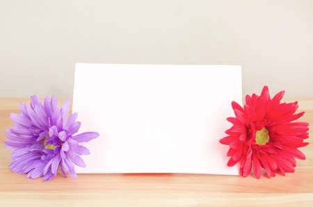 Pastel artificial flower with white note paper - vintage color and soft focusの写真素材