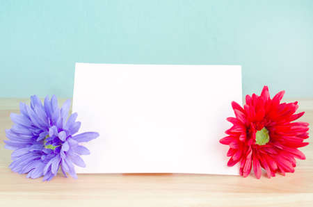 Pastel artificial flower with white note paper - vintage color and soft focusの写真素材