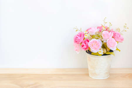 Pastel Coloured Artificial Pink Rose Wedding Bridal Bouquet in flower pot with soft vintage toneの写真素材