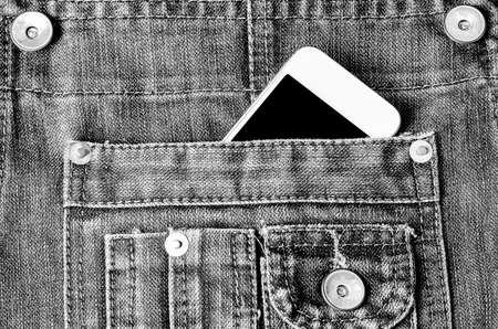Smart Phone with black screen in jeans pocket - Vintage Black and white toneの写真素材