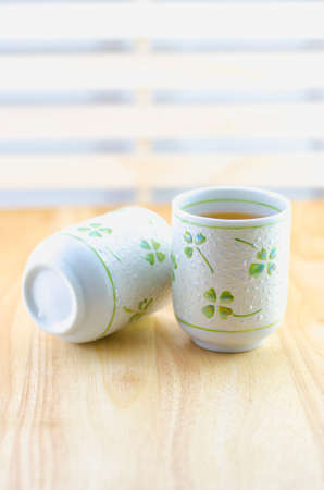 Two cup of japanese green tea on wooden tableの写真素材